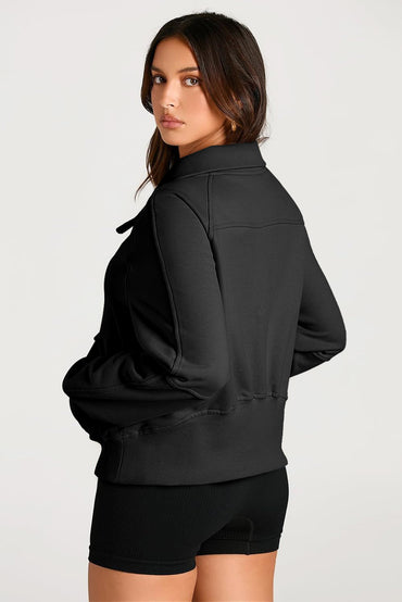 Chic black quarter zip sweatshirt with kangaroo pocket