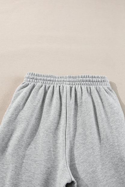 Cozy light grey fleece-lined joggers with adjustable drawstring waist