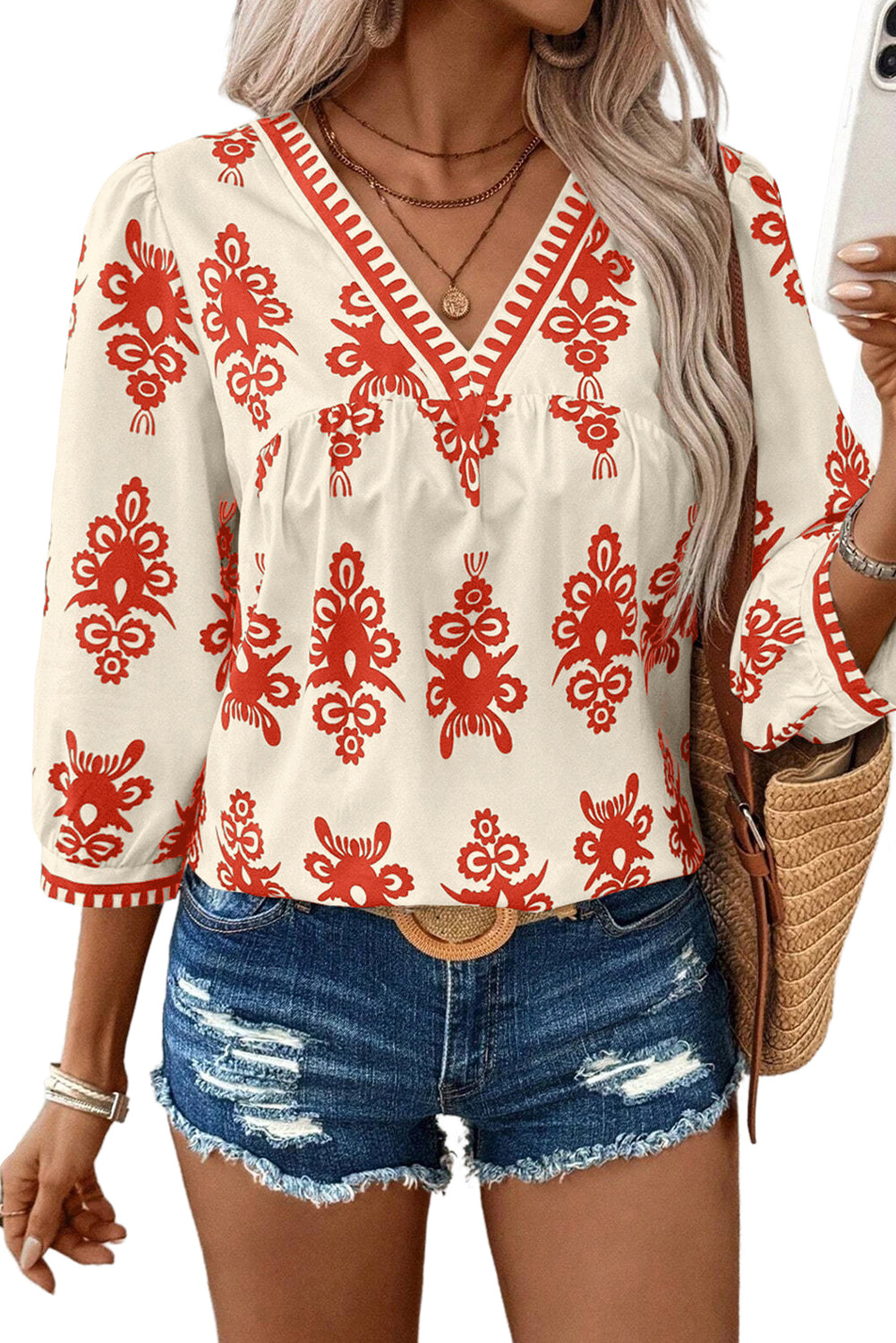 Chic orange geometric print V-neck blouse with 3/4 sleeves