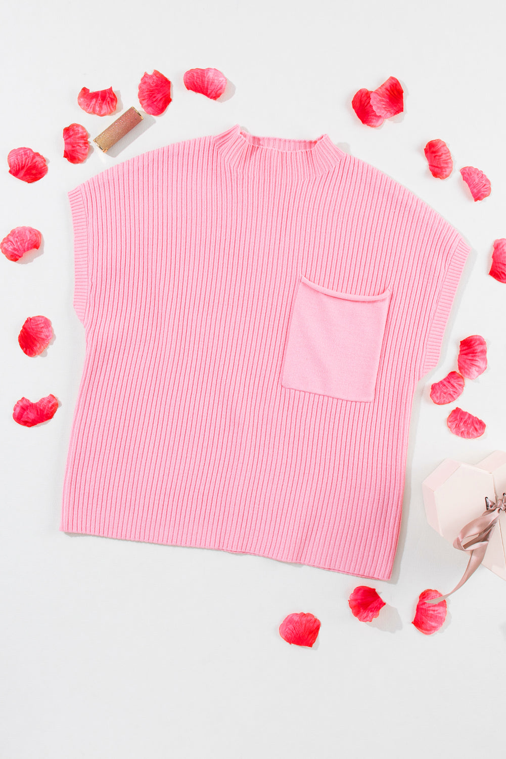 Cozy pink ribbed knit sweater with patch pocket and short sleeves