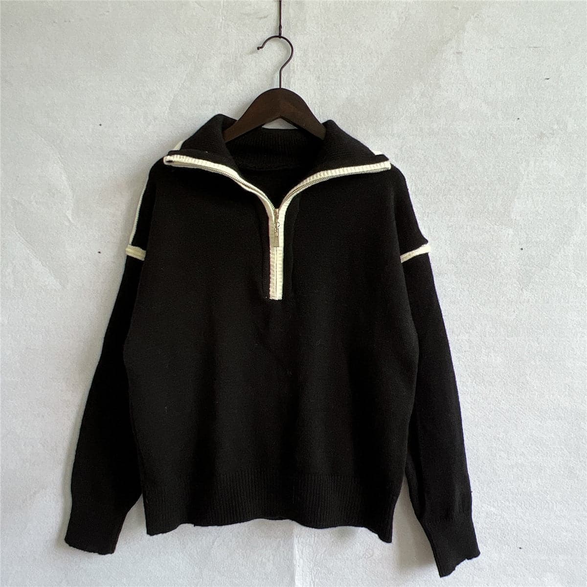 Exposed Seam Half Zip Sweater.