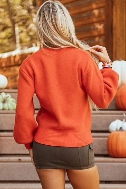 Spooky pumpkin face drop shoulder sweater for Halloween fun