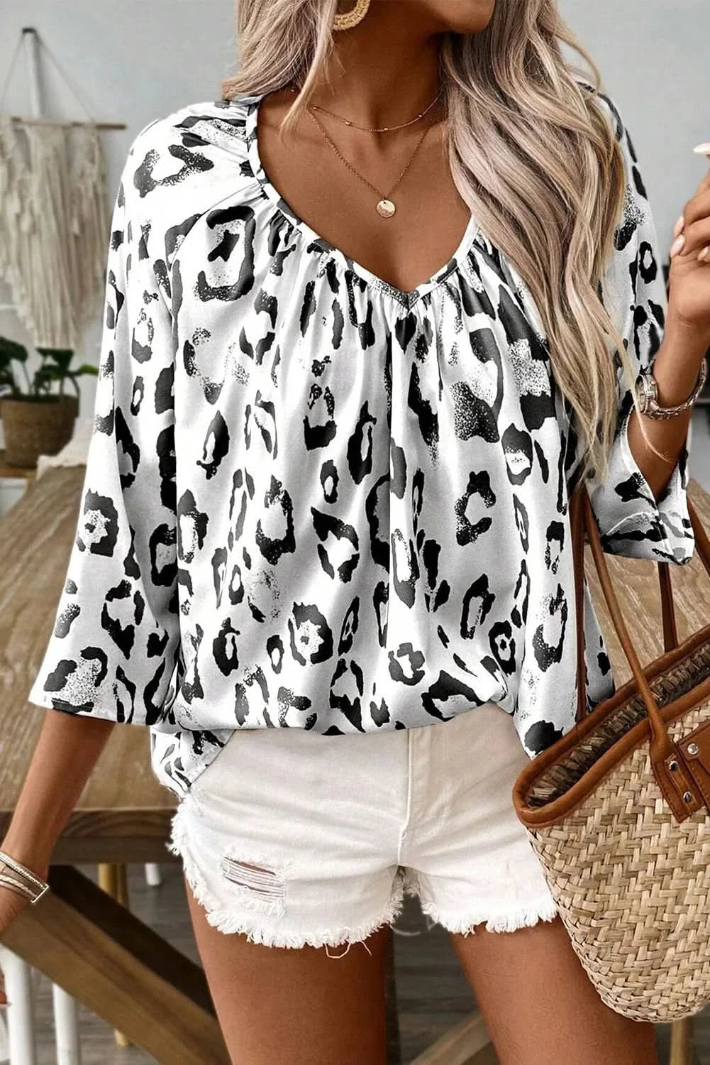 Leopard-print v-neck blouse with three-quarter sleeves