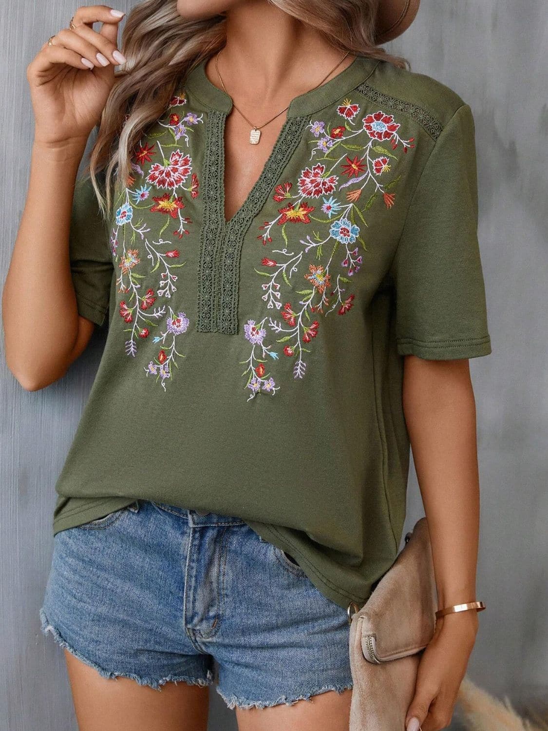 Embroidered Notched Short Sleeve T-Shirt.