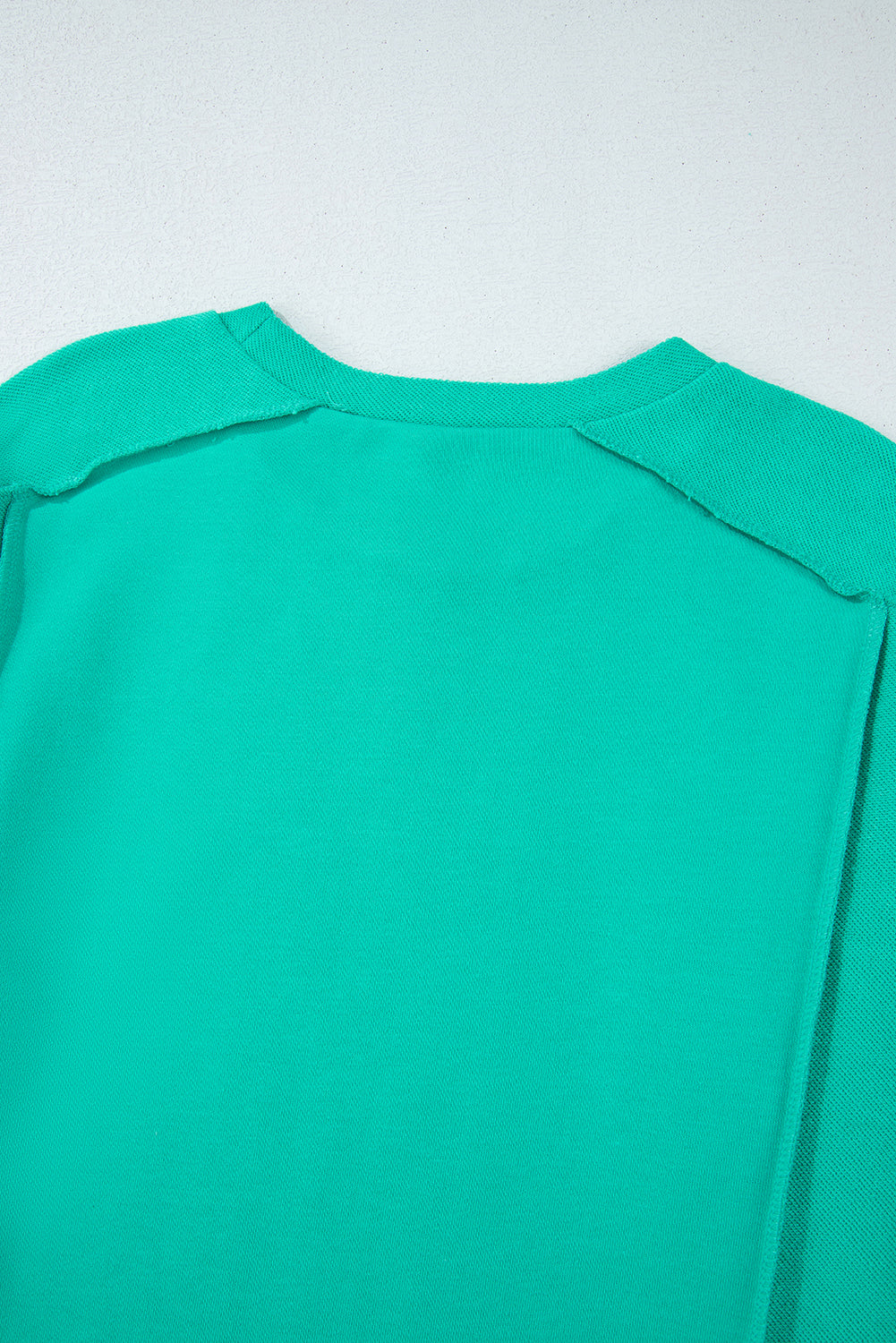 Mint green spliced pullover sweatshirt with round neckline