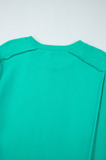 Mint green spliced pullover sweatshirt with round neckline