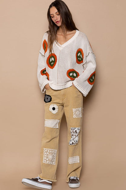 V-neck long sleeve sweater with peace pattern