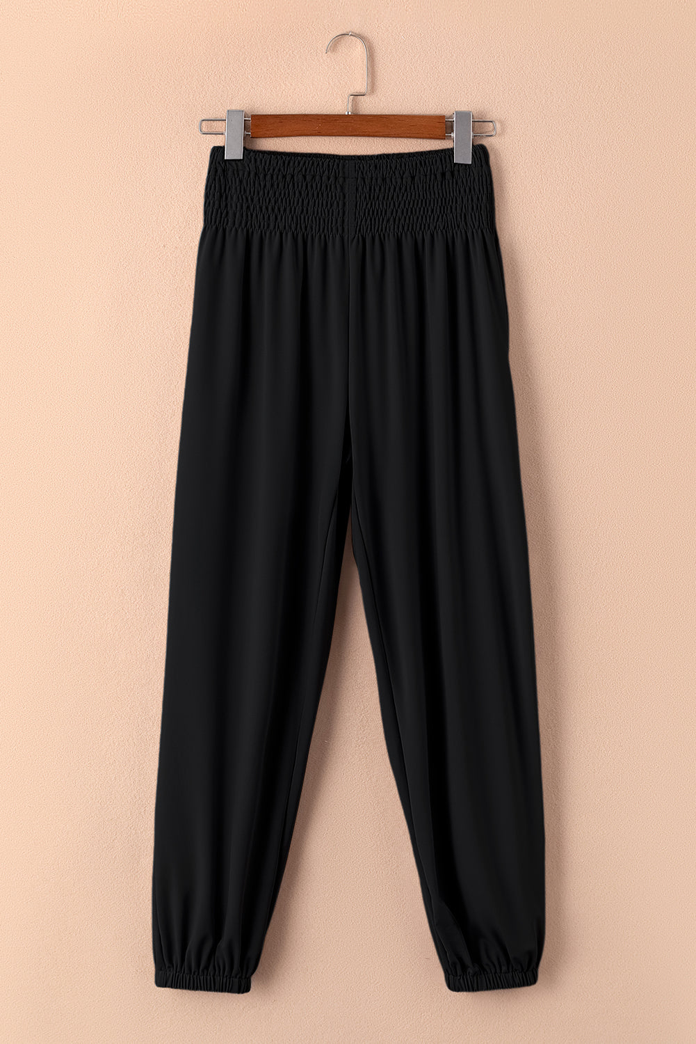 Chic black smocked high-rise joggers for a trendy look