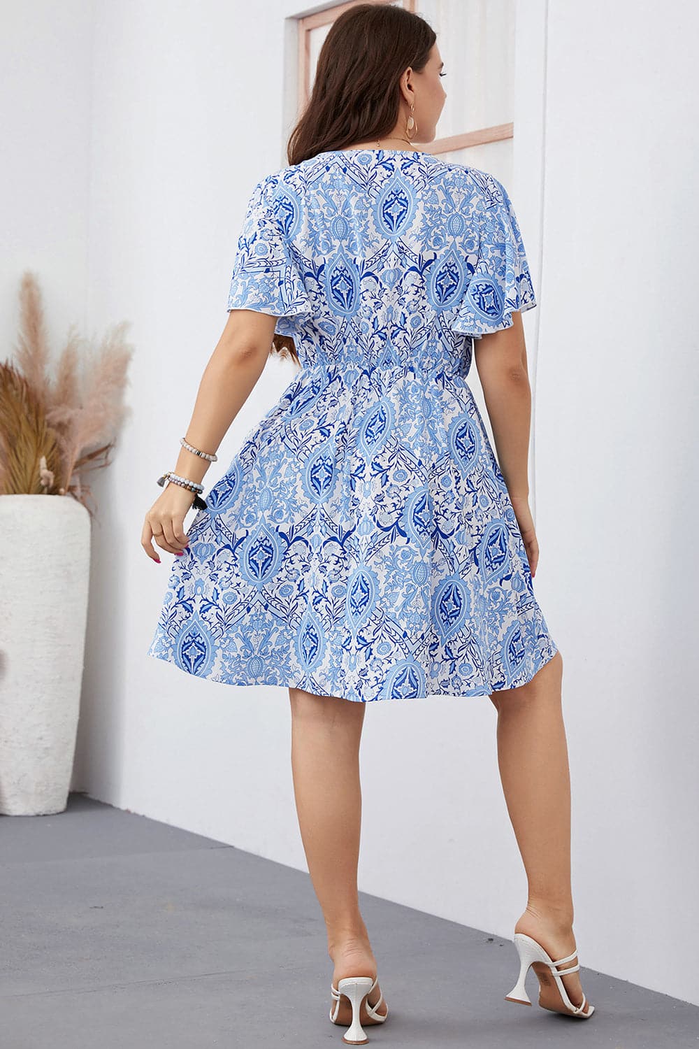 Plus Size Surplice Neck Flutter Sleeve Dress.