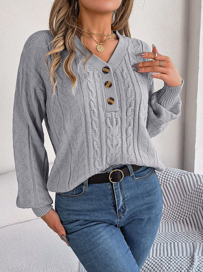 Chic cable-knit v-neck sweater with buttoned details