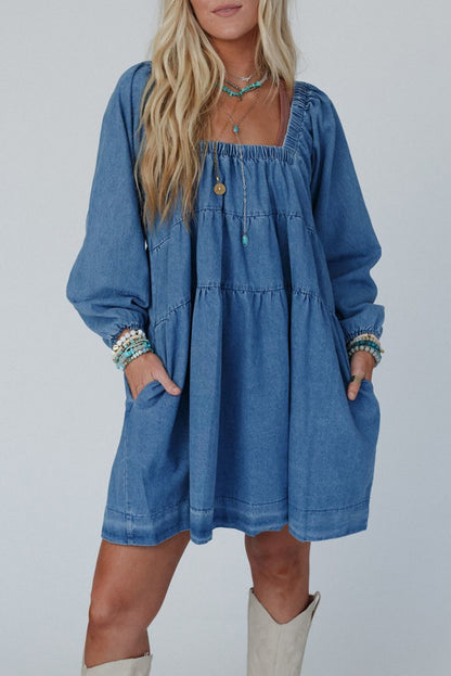 Dusk blue denim mini dress with long bishop sleeves and pockets.