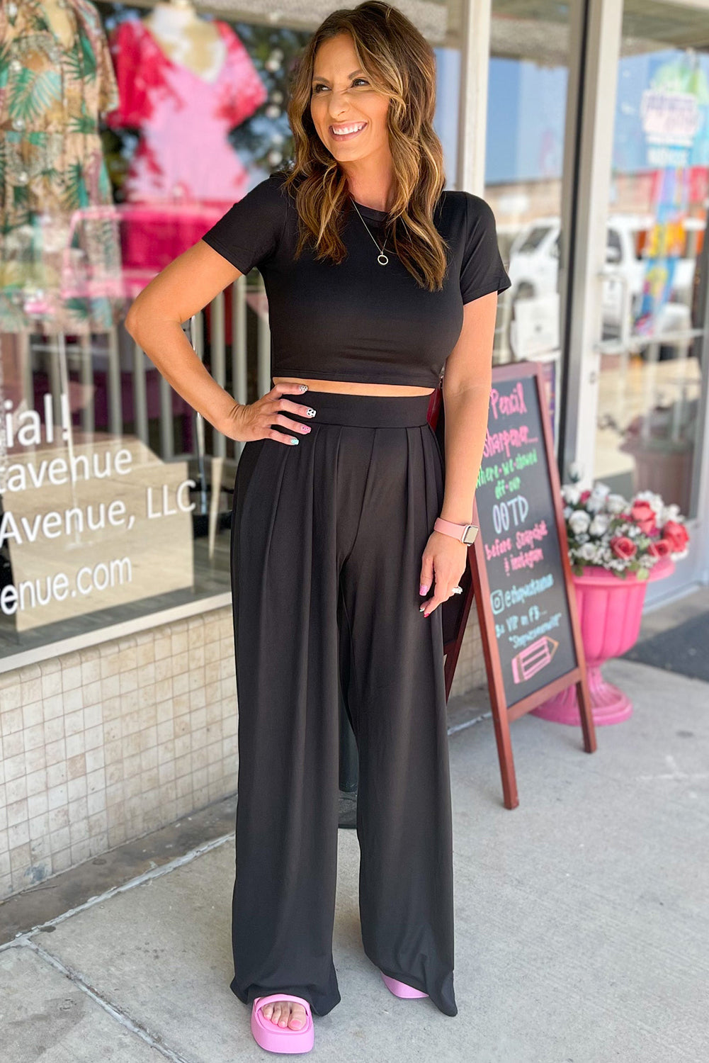 Chic black crop top and wide leg pants ensemble