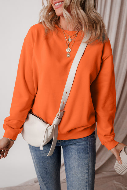 Cozy russet orange fleece-lined sweatshirt with drop shoulders