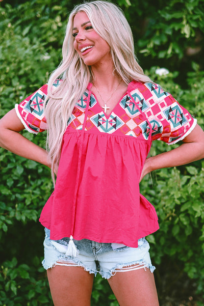 Chic strawberry pink geometric embroidered blouse with tassel tie neckline