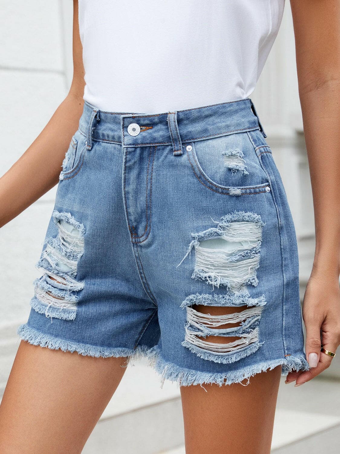 Distressed Raw Hem Denim Shorts.