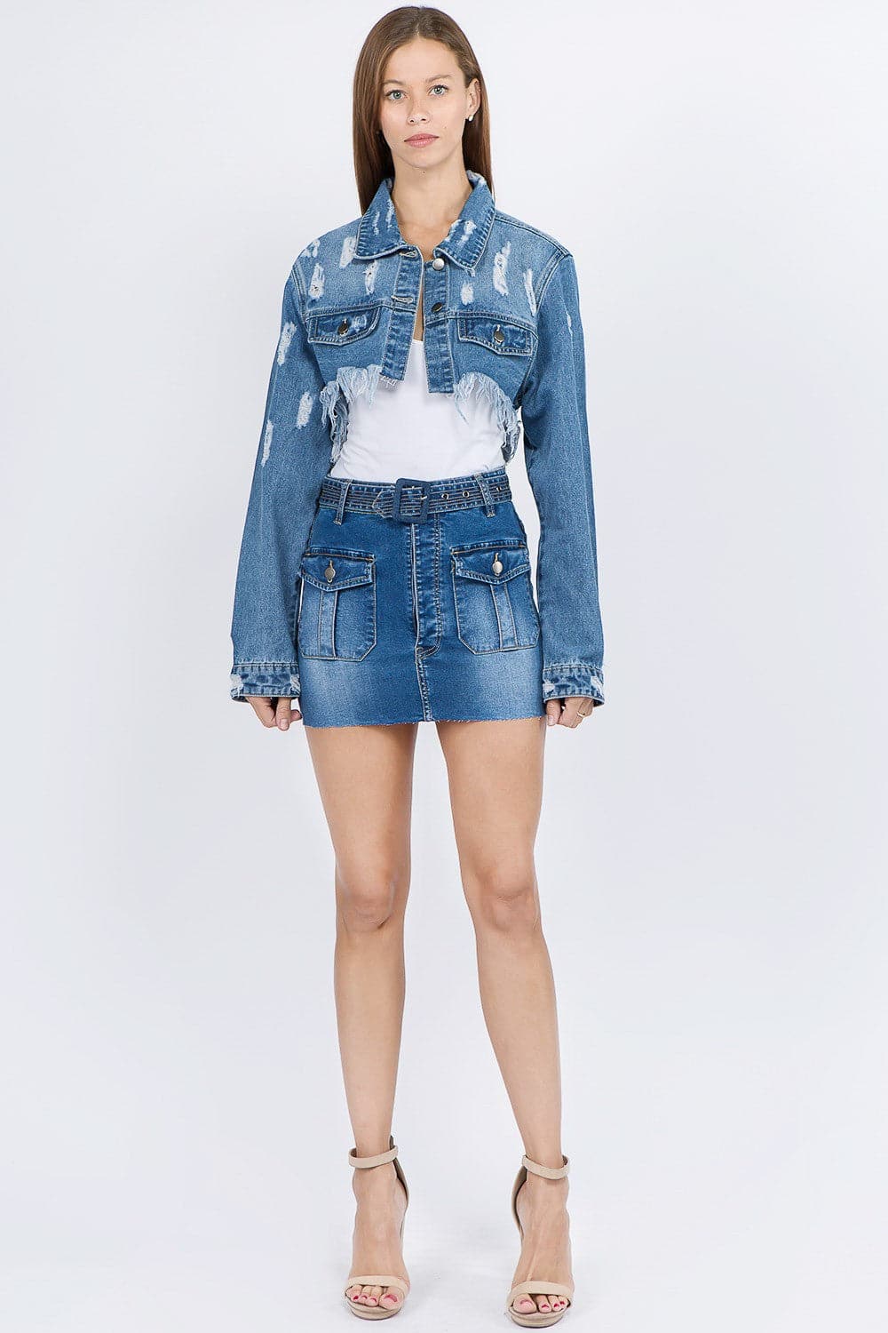 Chic cropped distressed denim jacket with frayed edges