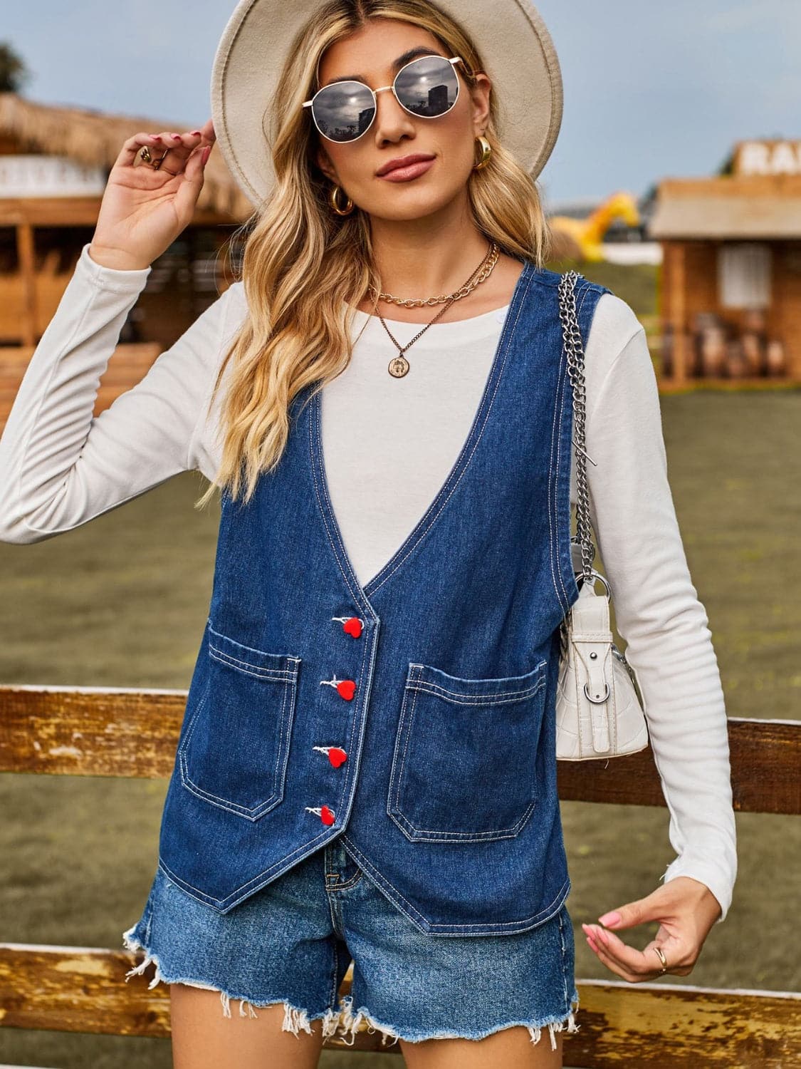 Pocketed Button Up Sleeveless Denim Jacket.