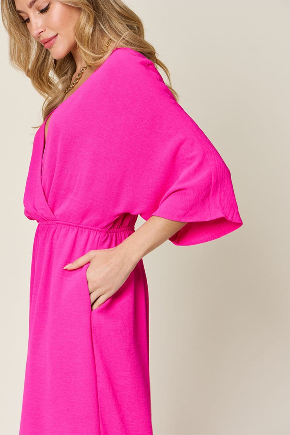 Double Take Full Size Surplice Wide Leg Jumpsuit with Pockets.