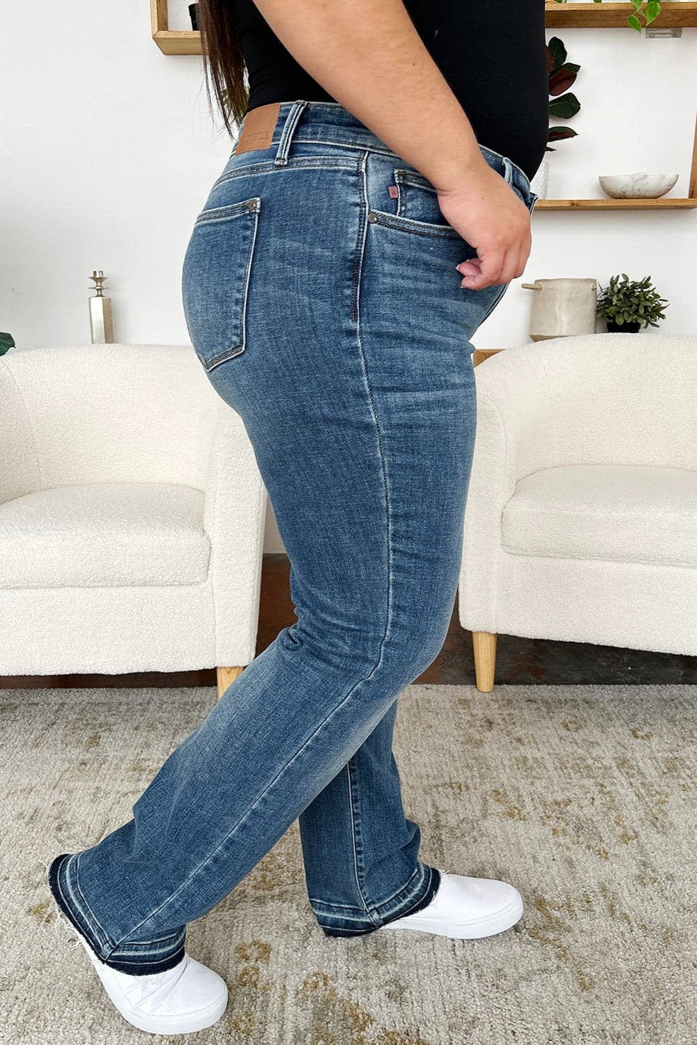 Trendy mid-rise release hem jeans by Judy Blue