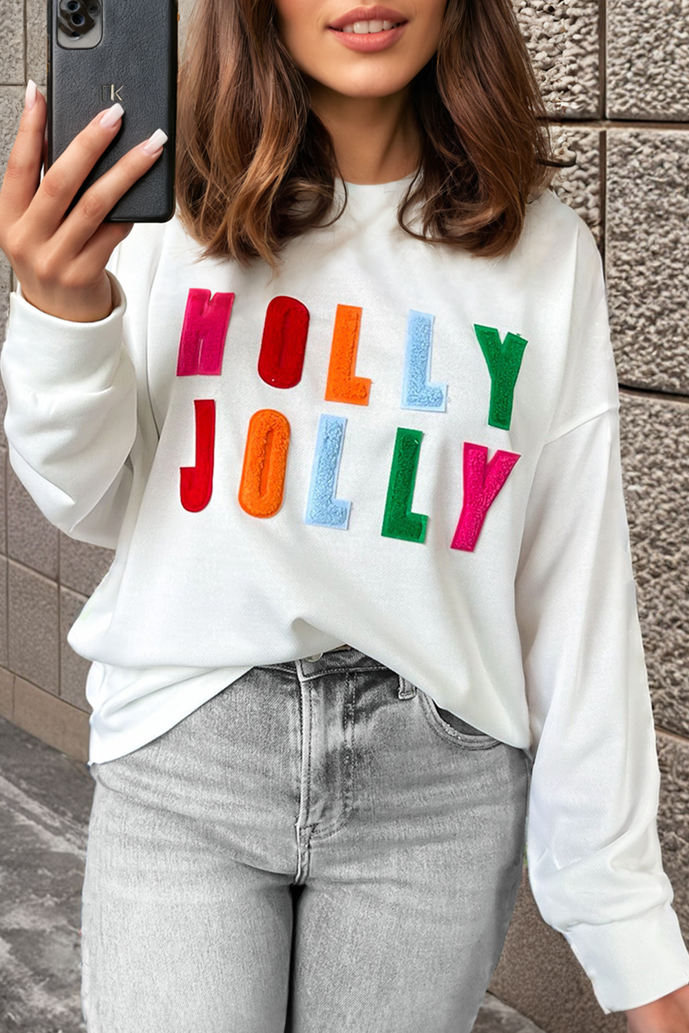 Celebrate in style with the cozy holiday graphic long sleeve top