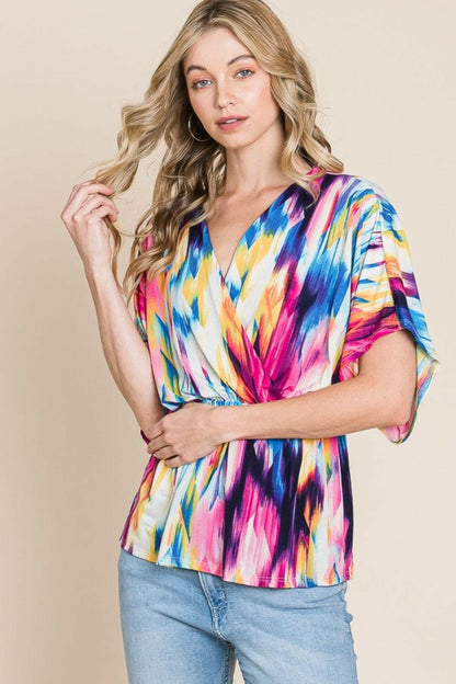 BOMBOM Printed Surplice Peplum Blouse.