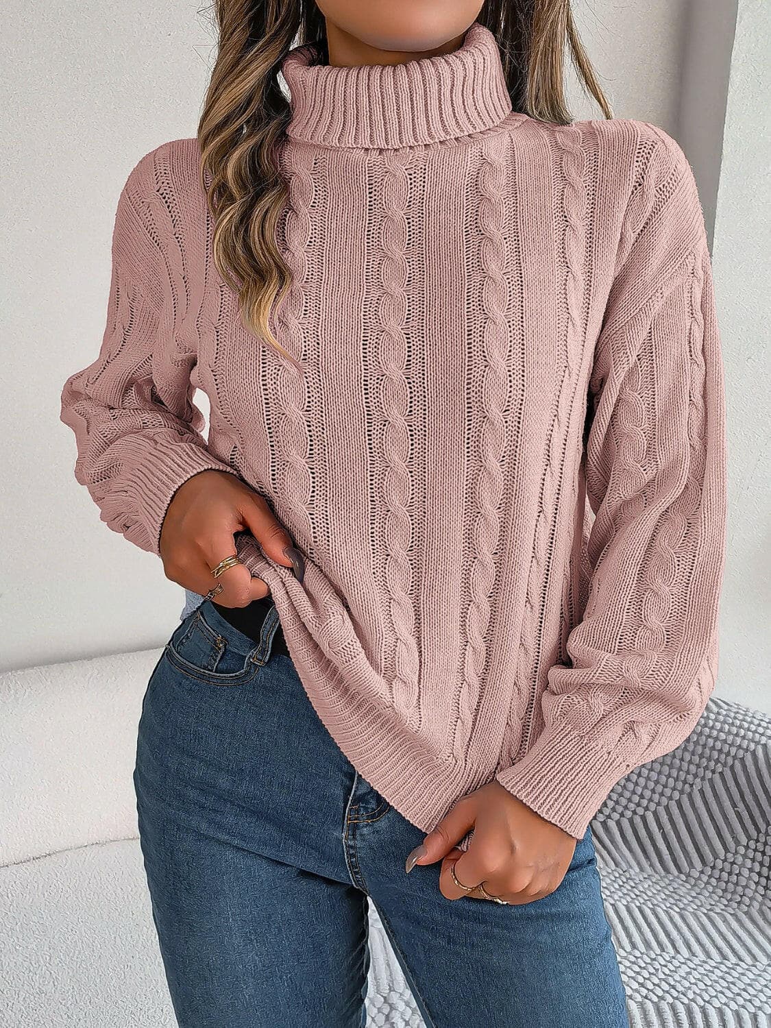 Cable-Knit Turtleneck Dropped Shoulder Sweater.