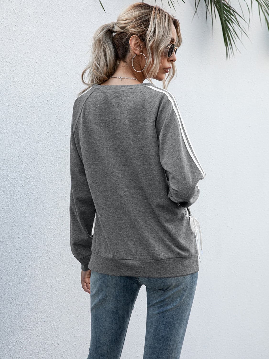 Lace-Up Round Neck Long Sleeve Sweatshirt.