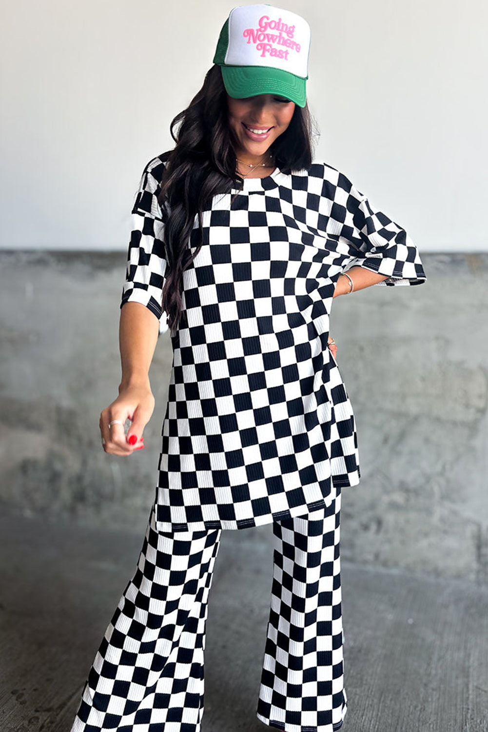 Chic black checkered tunic top and flared pant ensemble