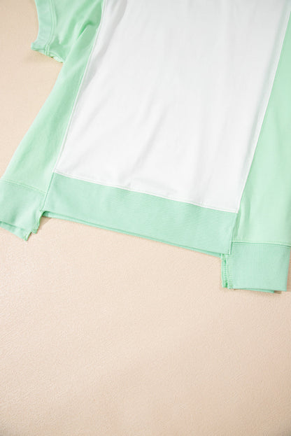 Light green color block crew neck t-shirt with exposed seam detail.