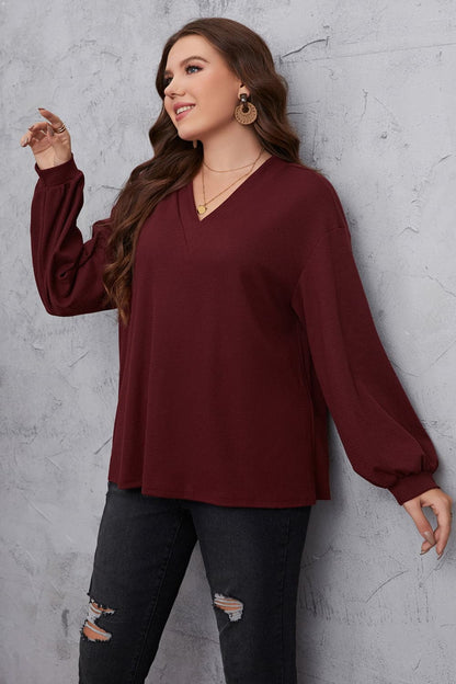 Melo Apparel Plus Size V-Neck Dropped Shoulder Blouse.