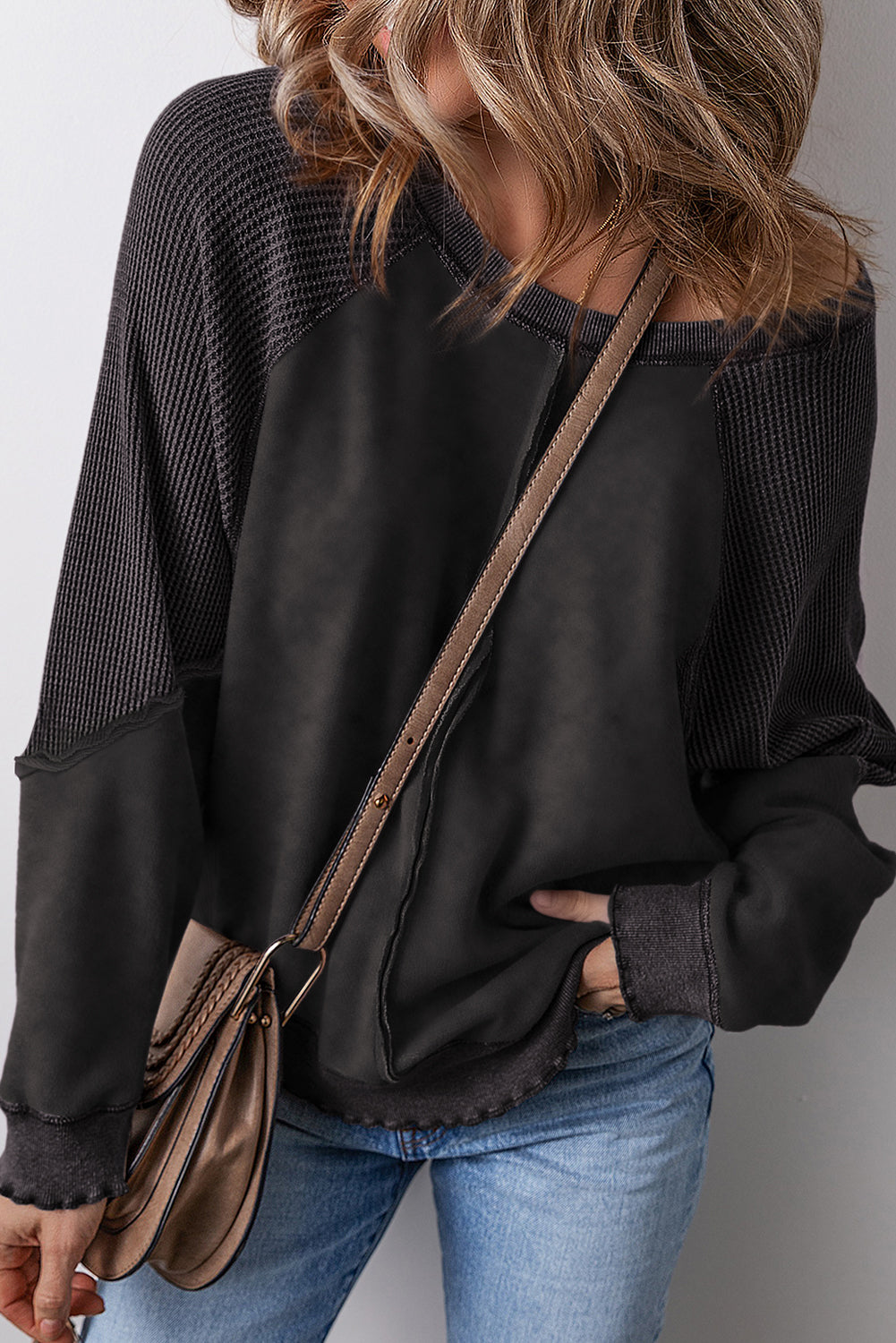 Chic black waffle knit raglan sleeve sweatshirt with patchwork detail