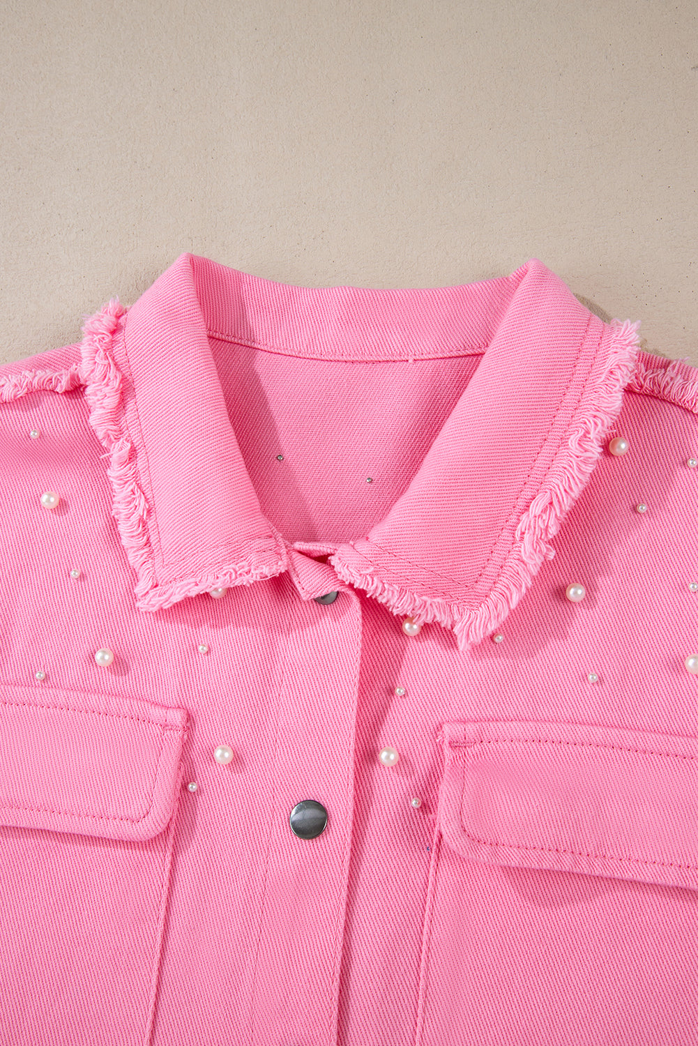 Chic bonbon pearl beaded denim jacket with raw hem detail