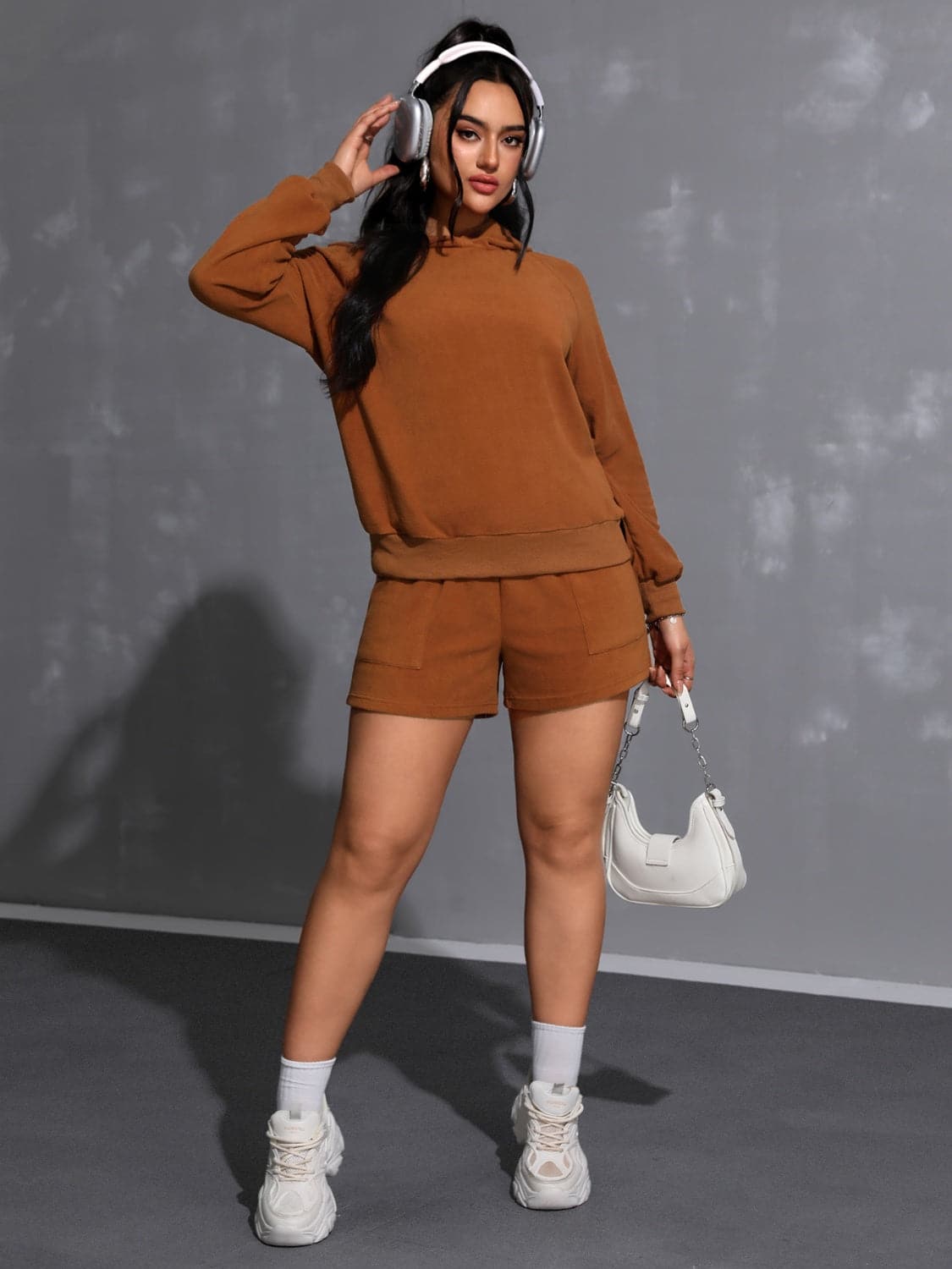 Cozy long sleeve hoodie and shorts ensemble with pockets