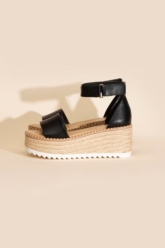 TUCKIN-S PLATFORM SANDALS.