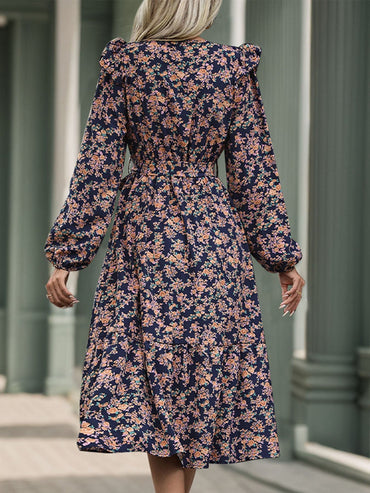 Chic Printed Surplice Dress with Tied Sheer Elegance