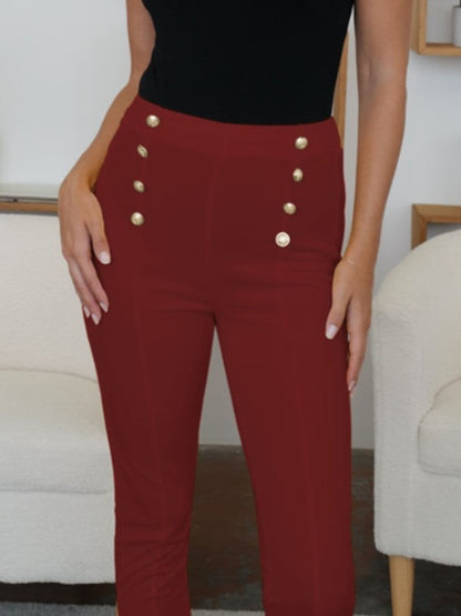 Stylish high-waisted skinny trousers with decorative buttons