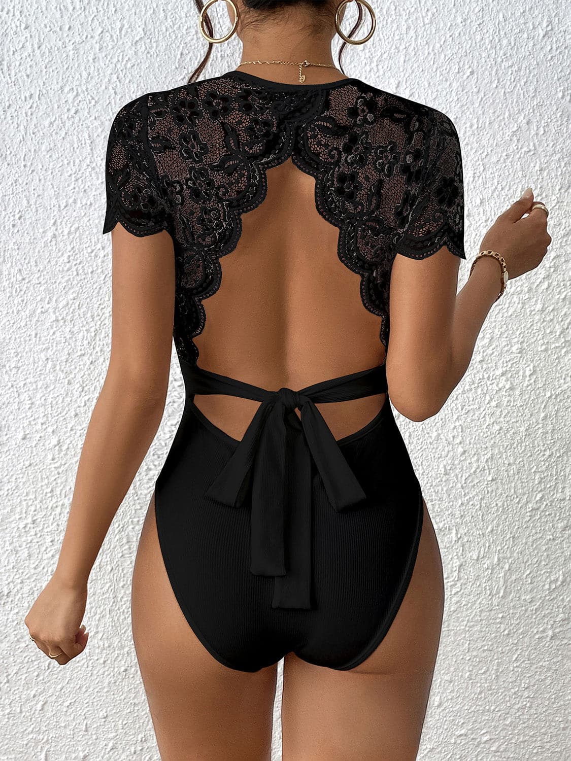 Lace Backless Round Neck Bodysuit.