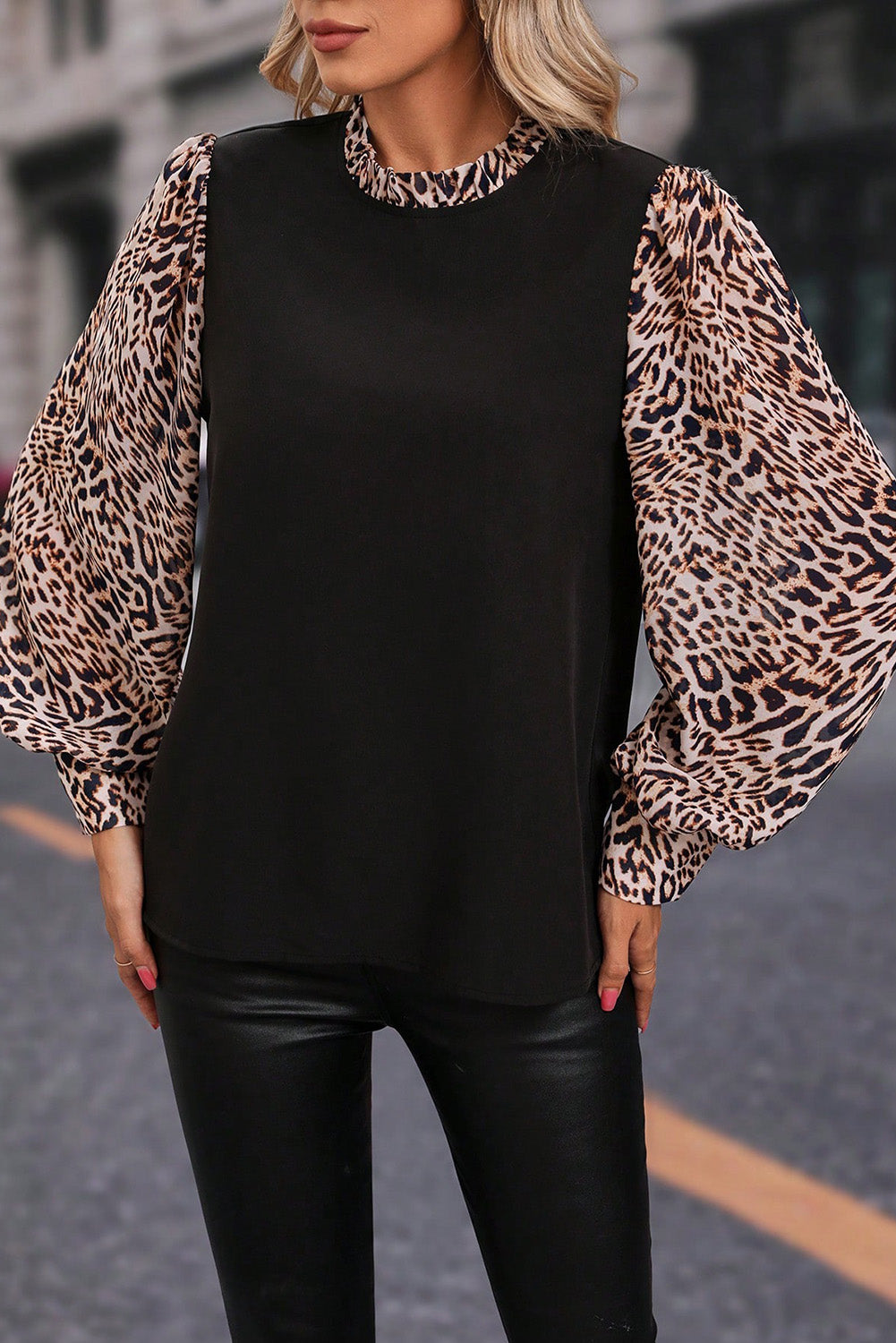 Elegant black lantern sleeve blouse with leopard print accents