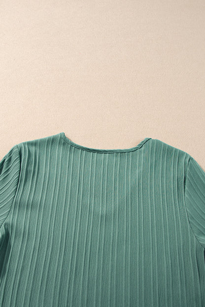 Chic grass green ruffled top with half sleeves and v-neck detail