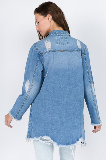 Distressed denim jacket with frayed hem for a vintage vibe