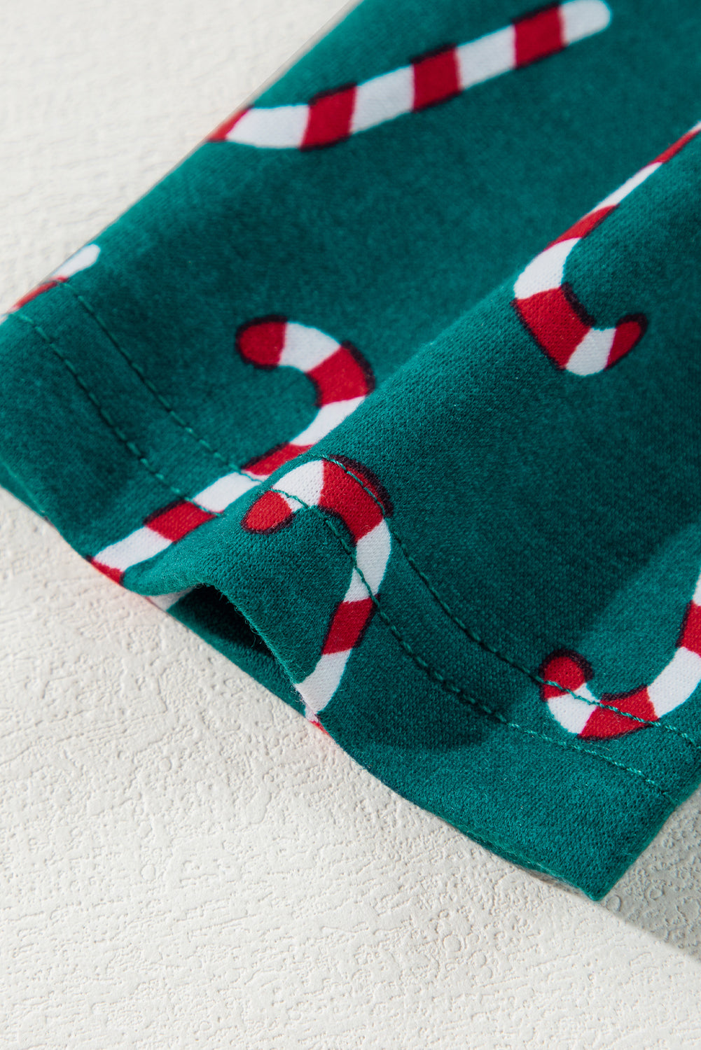 Festive green candy cane lounge set with stylish knot detail