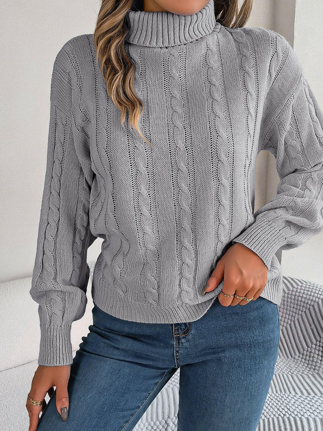 Cable-Knit Turtleneck Dropped Shoulder Sweater.