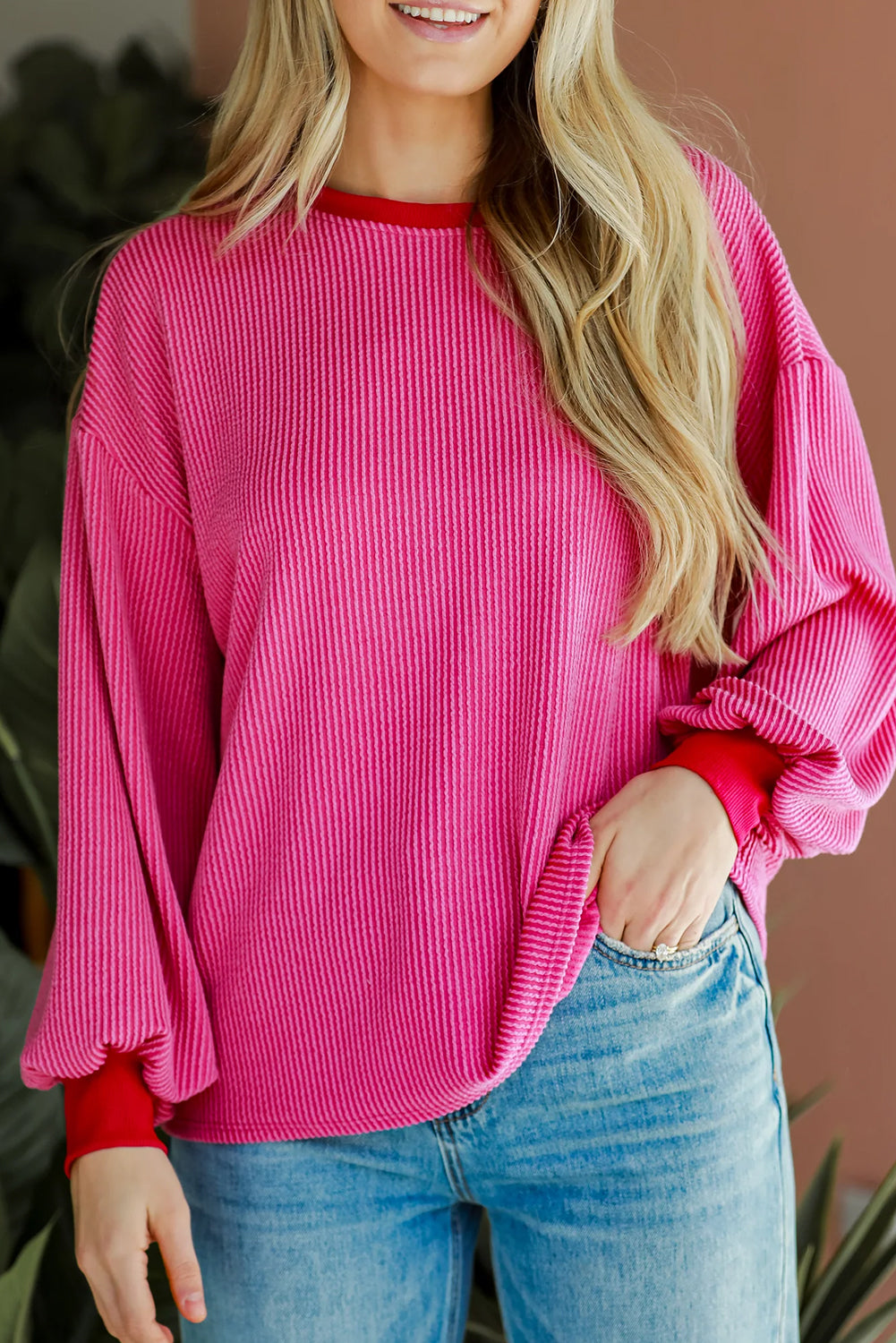 Bright pink drop shoulder top with corded design and contrast edge detail.