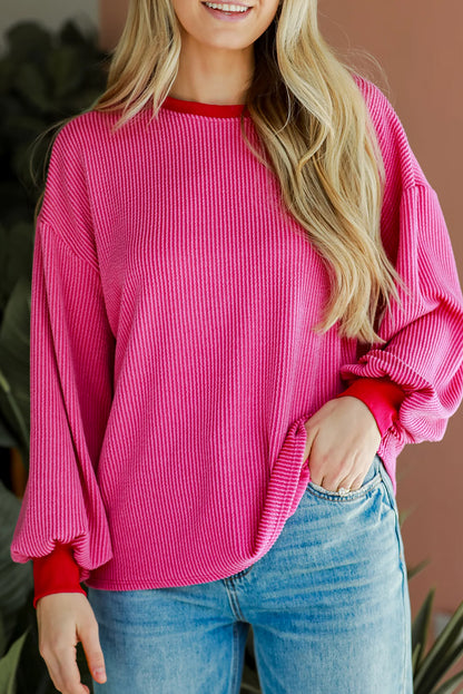 Vibrant pink corded edge drop shoulder long sleeve top