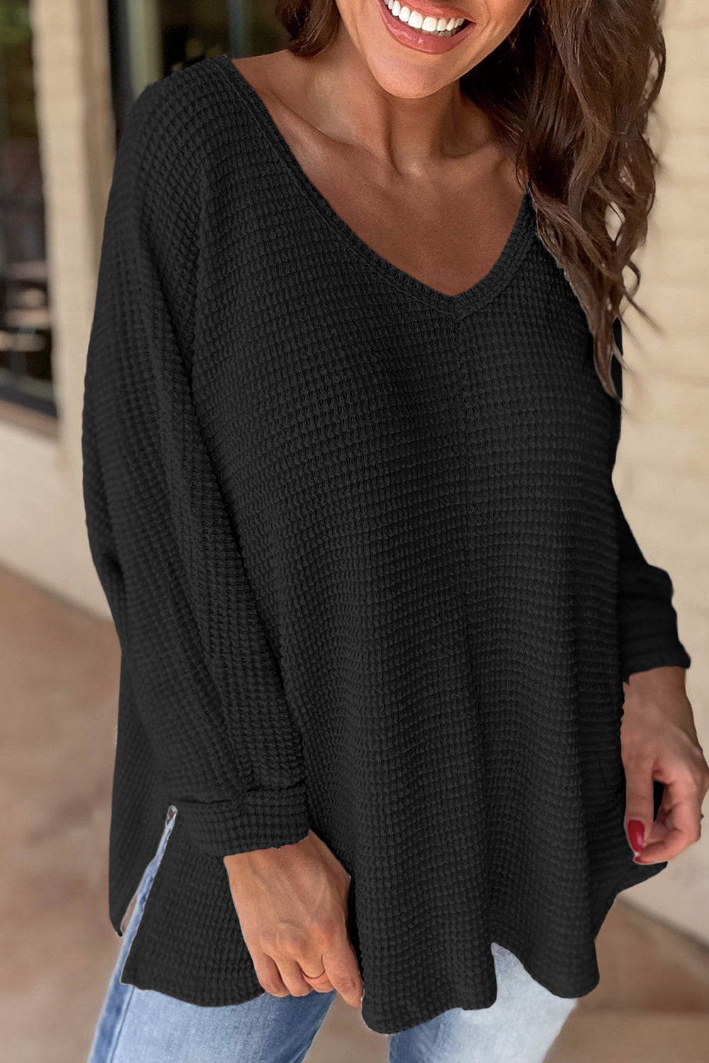 Chic black v-neck top with slits