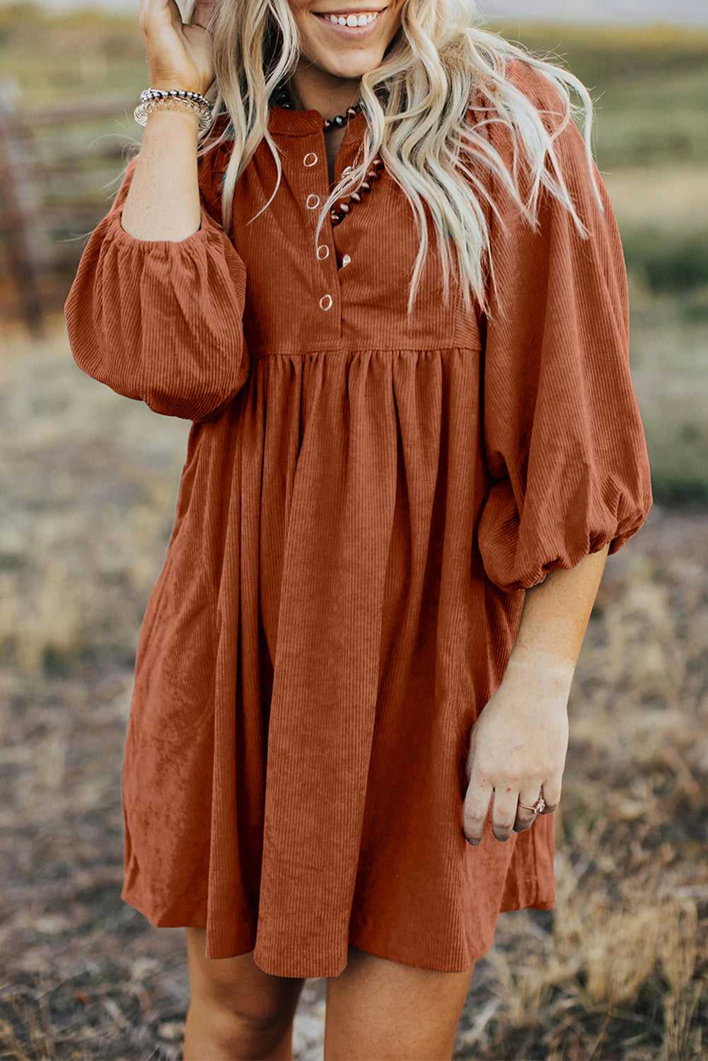 Chic gold flame corduroy dress with snap buttons and bracelet sleeves