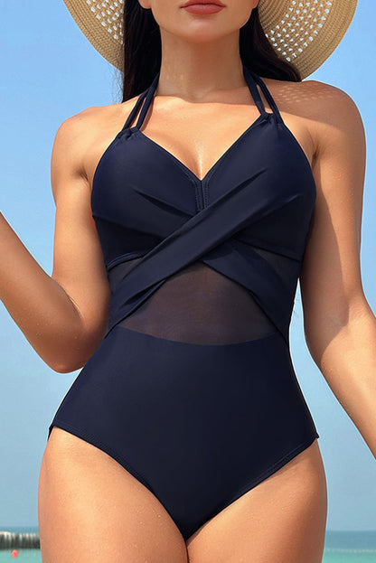 Elegantly chic navy blue halter one-piece swimsuit with mesh accents