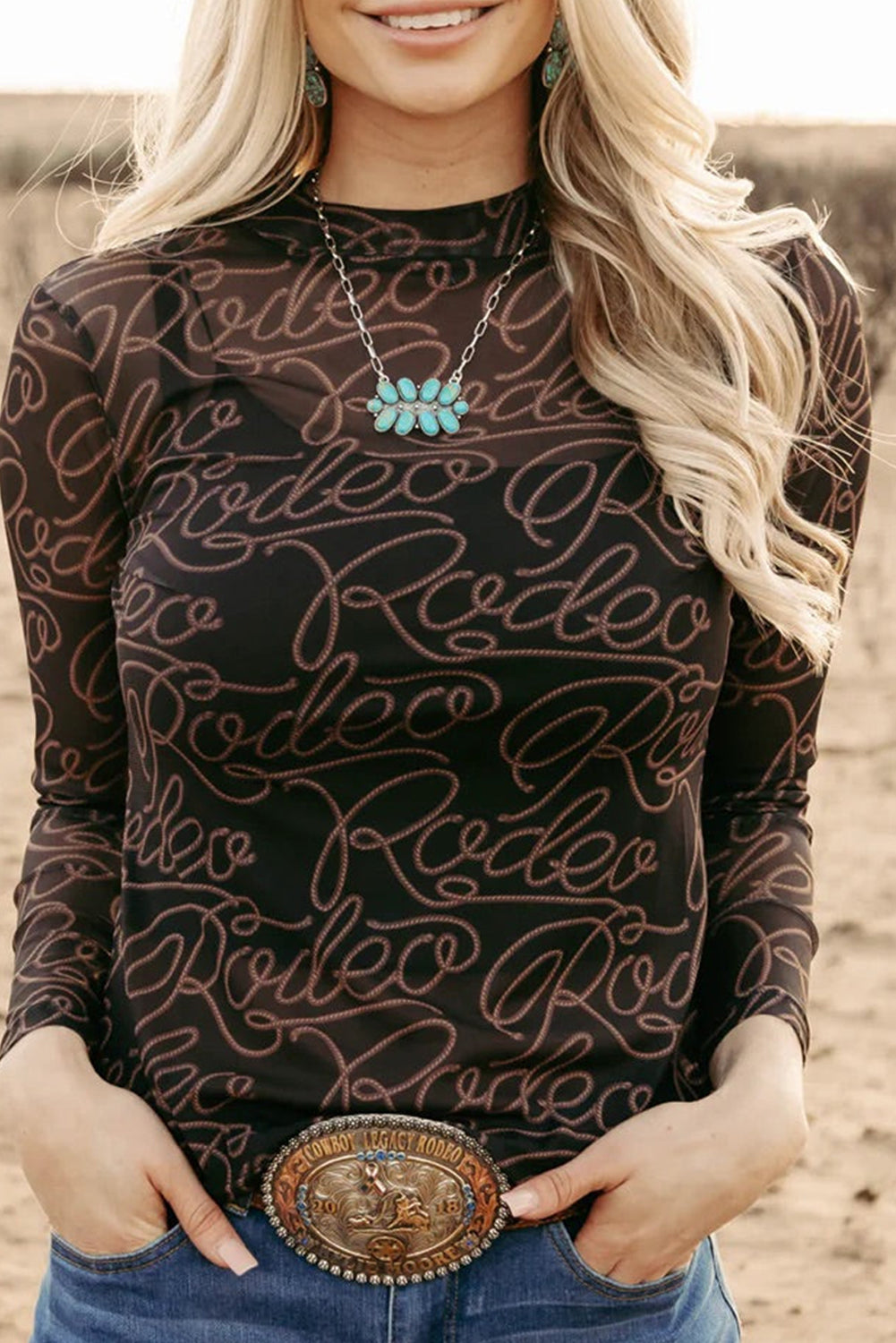 Rodeo chic: Black mesh long sleeve top with western print