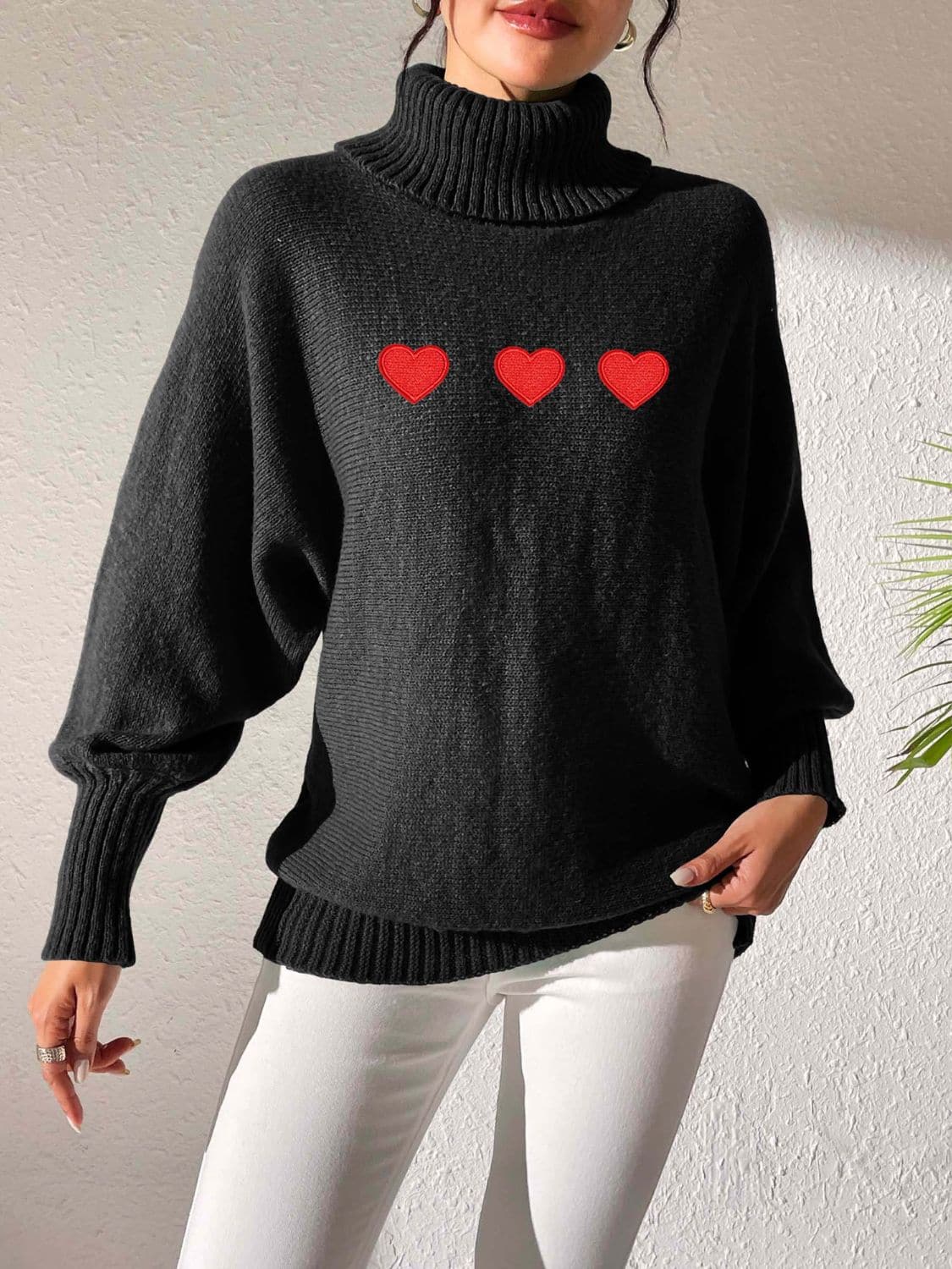 Charming heart-patterned turtleneck sweater with long sleeves