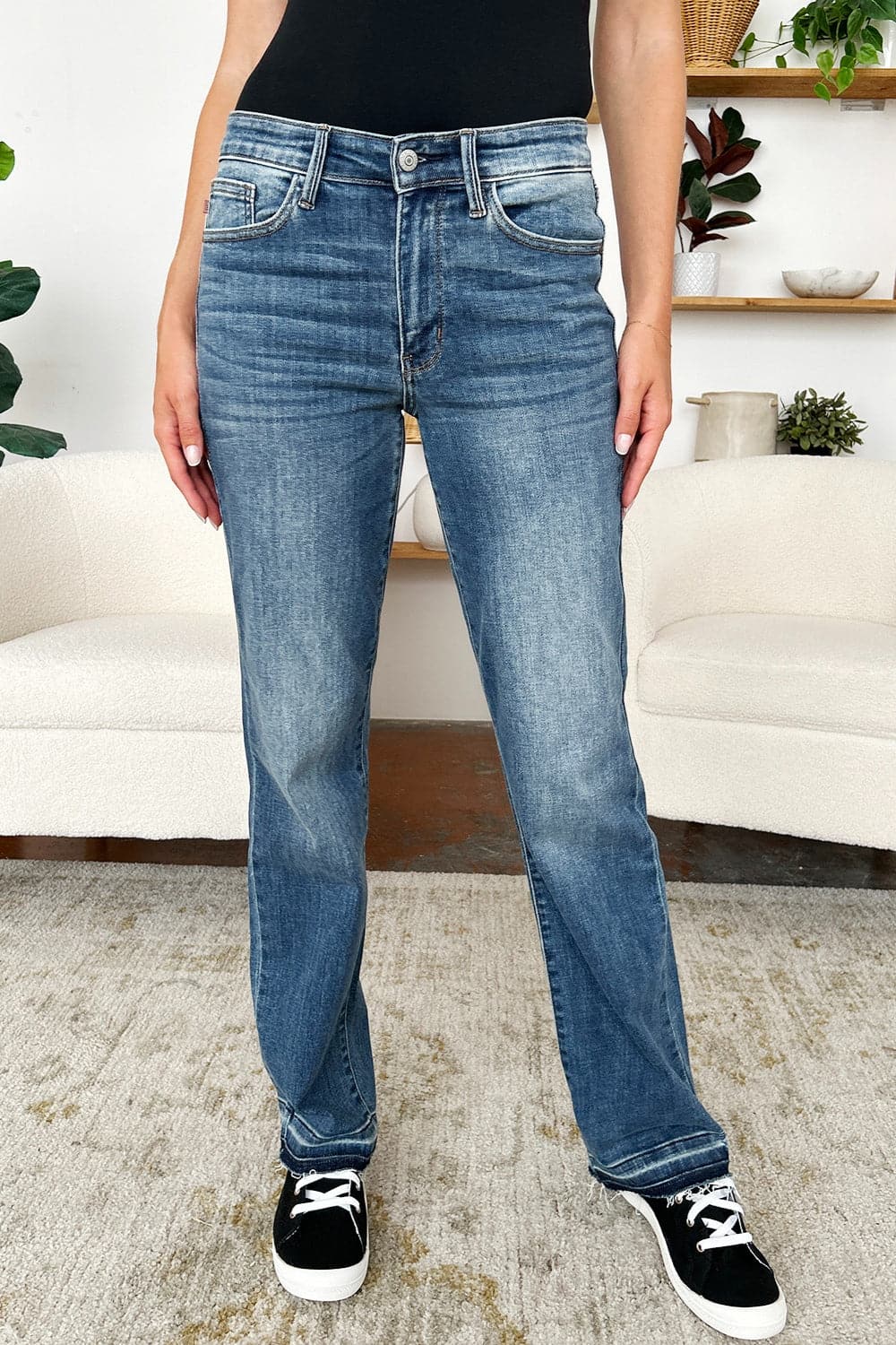 Trendy mid-rise release hem jeans by Judy Blue